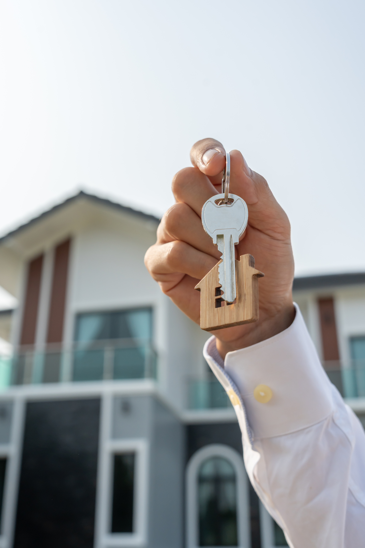 lease, rental and selling home. Real estate agent hold key for new house or real estate. rent house, Sales, loan credit financial, insurance, Seller, dealer, installment, buy, sell, move in